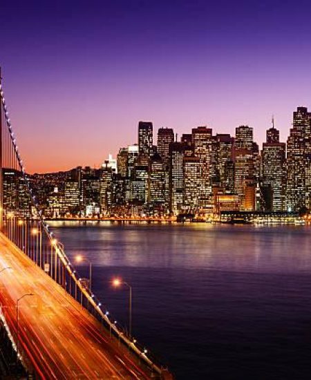 San Francisco skyline and Bay Bridge at sunset, California